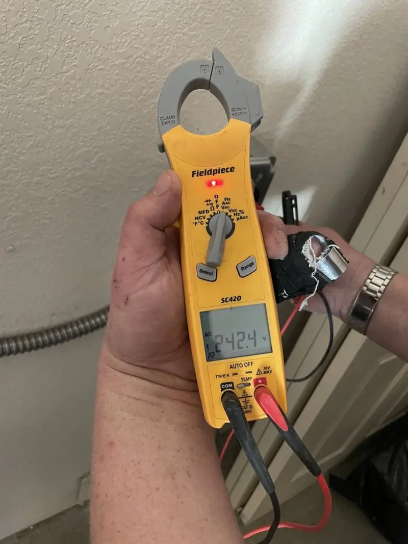 Voltage testing with clamp meter during Circuit Breaker Repair in Sussex